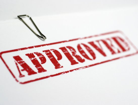 Paper with paper clips and the text "APPROVED" Paper with paper clips and the text "APPROVED"